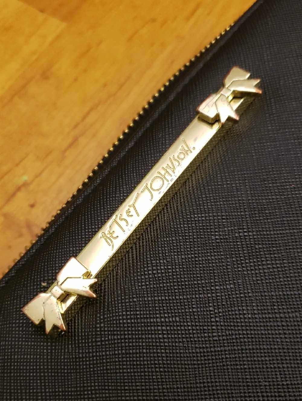 Betsey Johnson Black Wallet Wristlet with Gold Logo Bar and Bow Accents
